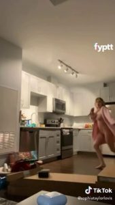 This girl is so happy that she’s dancing naked on TikTok in the kitchen