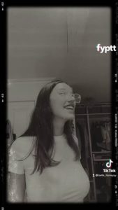 Nerdy looking girl with big tits on TikTok doing photogenic filter trend